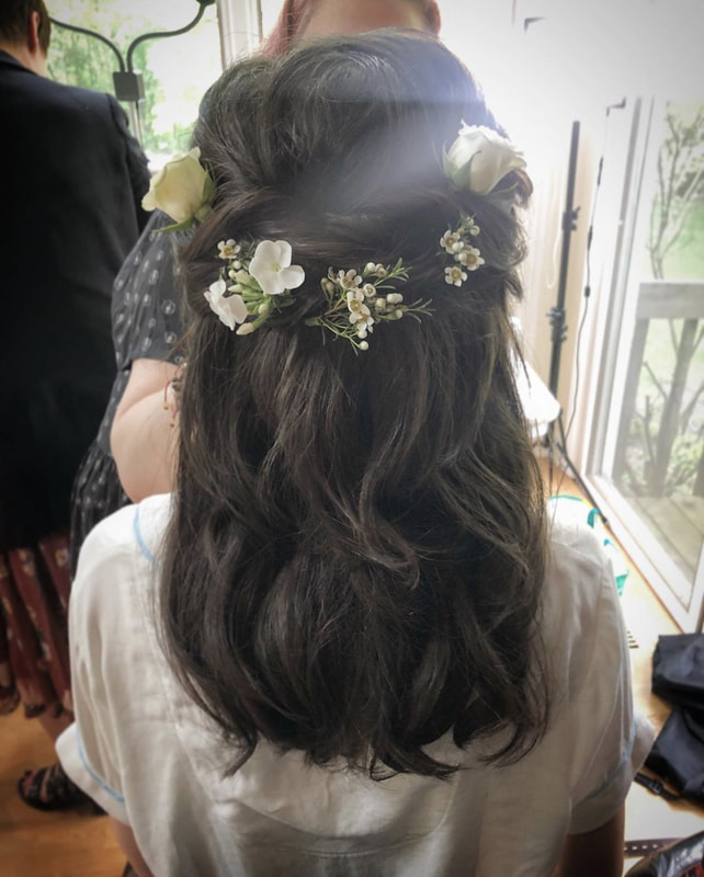 Brunette half up wedding hair style with floral crown